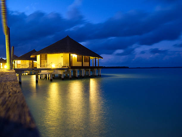istock Overwater bungalows in tropical island 459140467