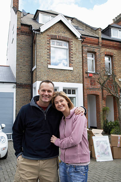 istock Happy Couple In Front Of House 459143389