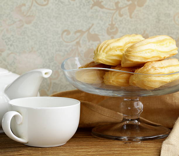 istock choux pastry eclairs on glass stand base 459152411