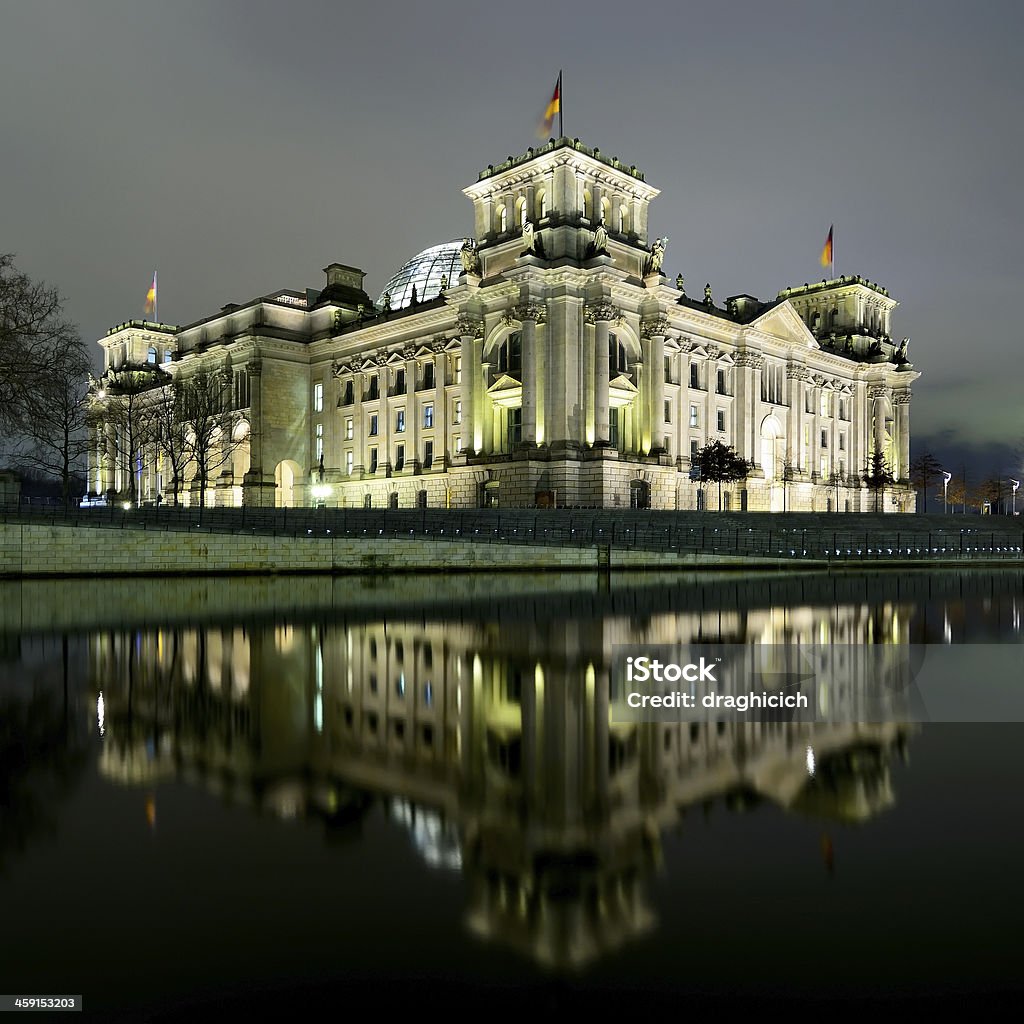 berlin reichstag at night reichstag (bundestag) with reflection in spree river in berlin, germany at night Architecture Stock Photo