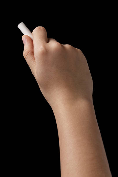 istock female teen hand with chalk to write something 459154375
