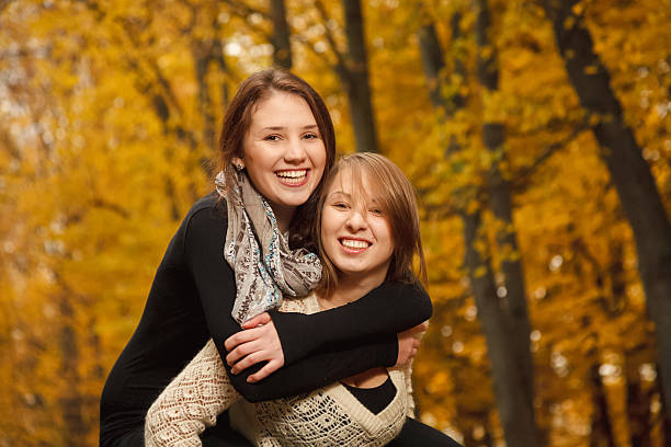 istock piggyback ride in autumn forest 459154671