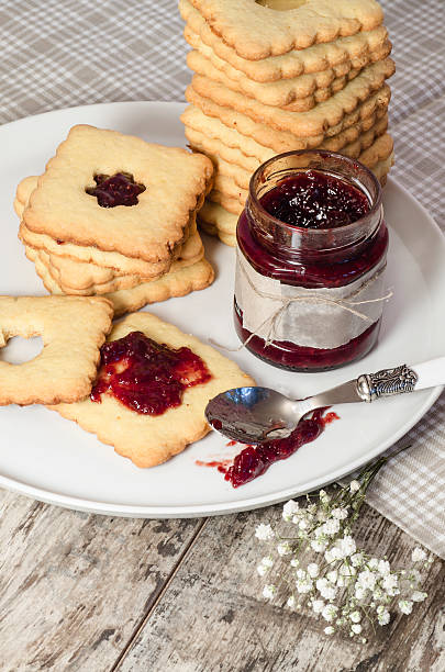 istock Homemade sugar cookies with jam decorated flowers. 459157883
