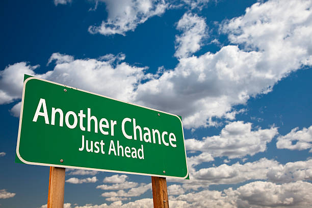istock Another Chance Just Ahead Green Road Sign Over Sky 459159457