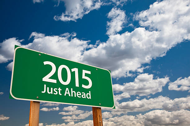 istock Just Ahead, 2015 Green Road Sign Over Clouds and Sky 459159459