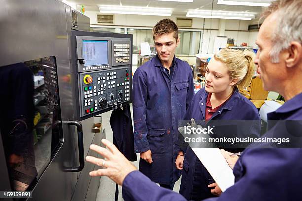 Engineer Students Learn To Use Computerized Lathe Stock Photo - Download Image Now - Machinery, Education Training Class, Trainee