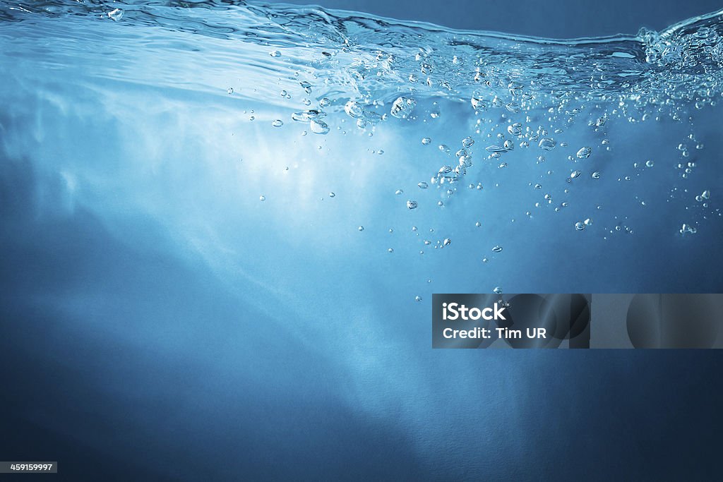 Abstract blue background. Water with sunbeams Water Stock Photo