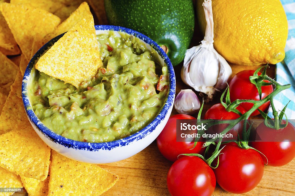 Avocado guacamole ingredients Ingredients for avocado guacamole with tortilla chips Avocado Stock Photo