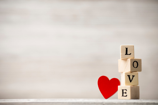 Love message written in wooden blocks.