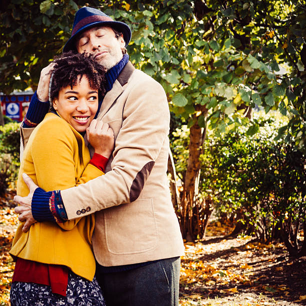 Couple Embracing In The Autumn Park