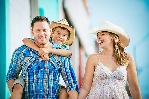 Western family having fun Western family having fun outdoors texas cowboy stock pictures, royalty-free photos & images