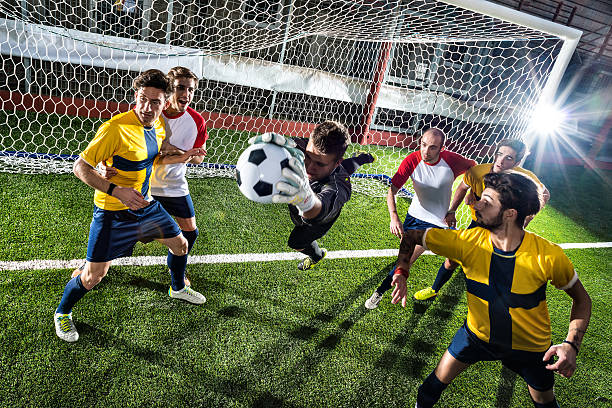 istock Football match in stadium: Goalkeeper save 459163923