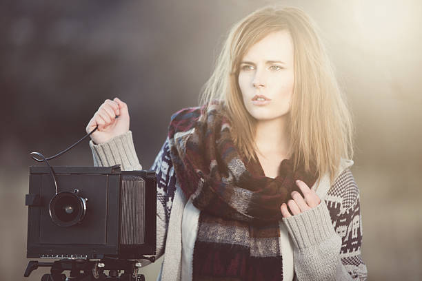 Young Woman with Vintage Bellow Camera