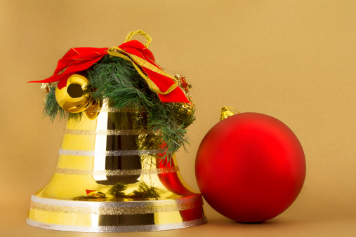 Christmas bell on white with a red christmas ball.