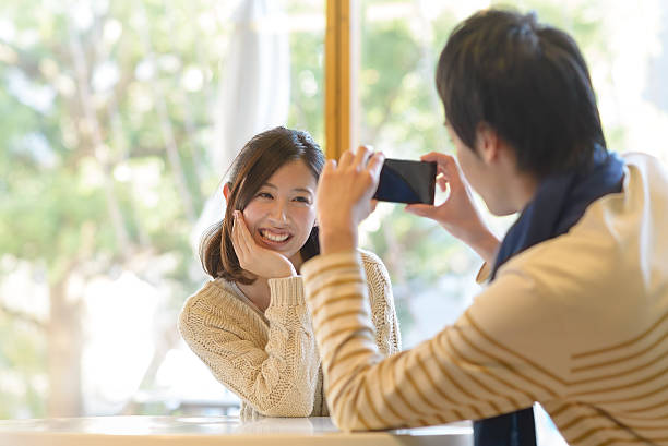istock Young couple taking photo with smartphone 459169463
