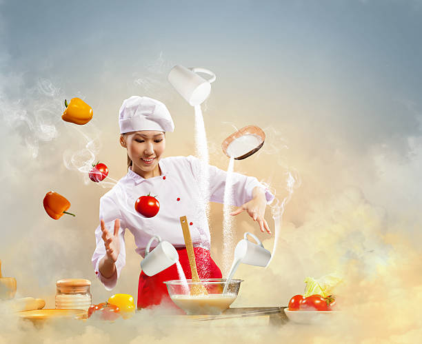 istock Asian female cooking with magic 459169901