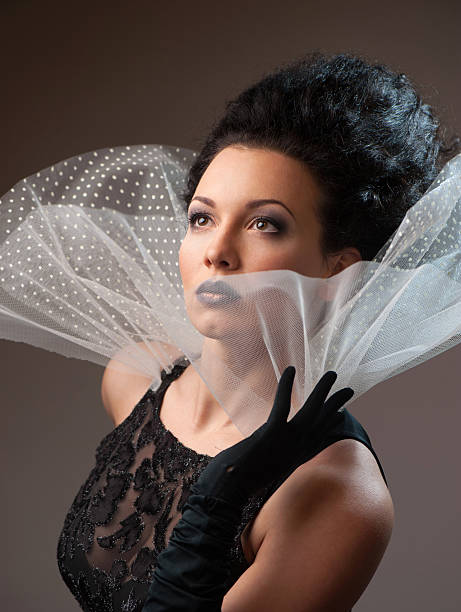 istock Young elegant queen in black dress 459170209