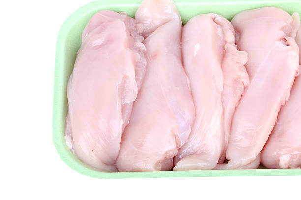 istock Uncooked chicken breast fillet in package 459174623