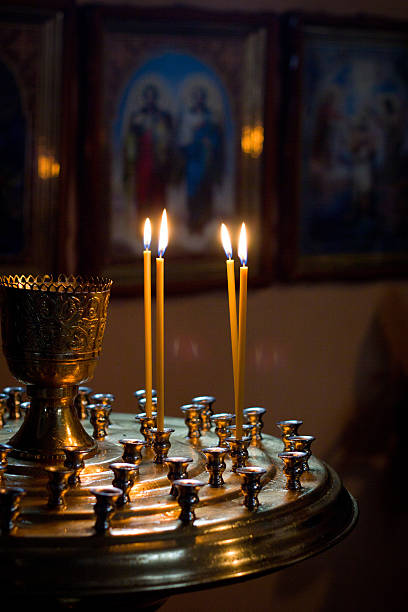 istock Prayful candle against an icon 459180247