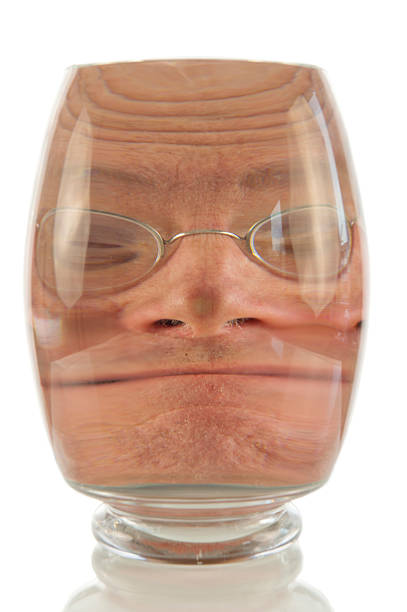 istock Crazy face locked up in glass 459191875