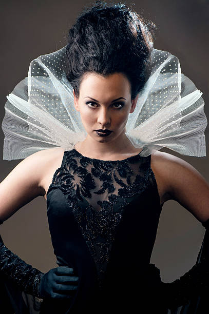 istock Young elegant queen in black dress 459192947