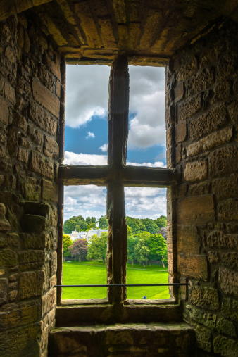Old window with view to the garden