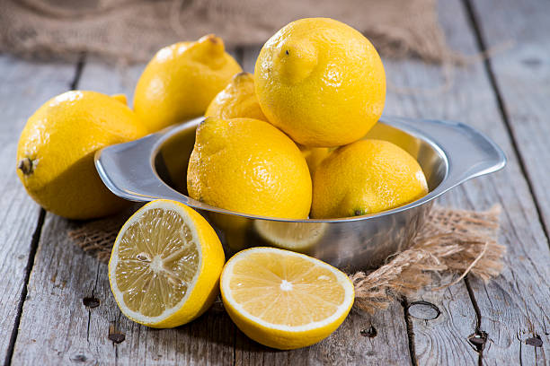 istock Lemons on vintage wooden background 459198021