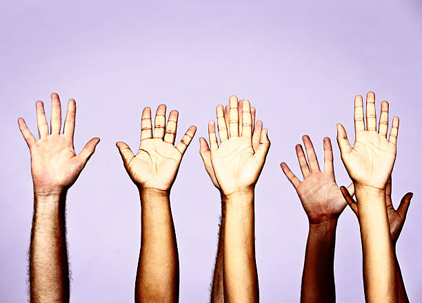 istock Put your hands up! Seven enthusiastically raised arms 459201977
