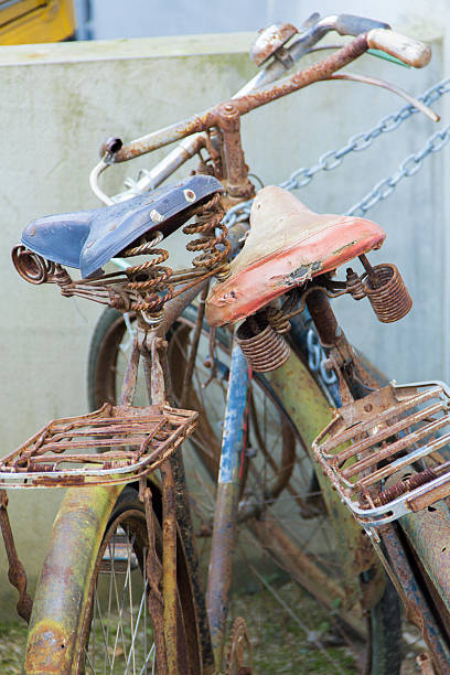 istock Unrideable bicycles locked with a brand new chain 459204711