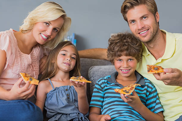 istock Cheerful family sharing a pizza 459205311