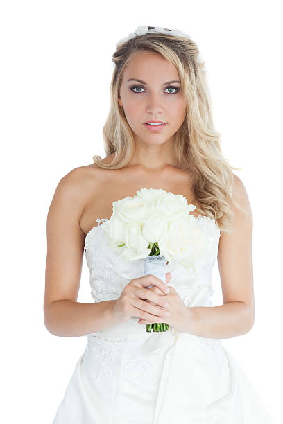 istock Thinking young blonde bride holding a bouquet 459205423