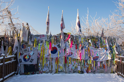 Gyeonggi, South Korea - December 14, 2013: Gateway to Freedom Bridge between South and North Korea, DMZ, 38th Parallel, with notes, letters and banners symbolic of reaching out for unification.