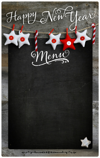Special Christmas and New Year`s holiday restaurant bistro menu design on vintage wooden blackboard with copy space
