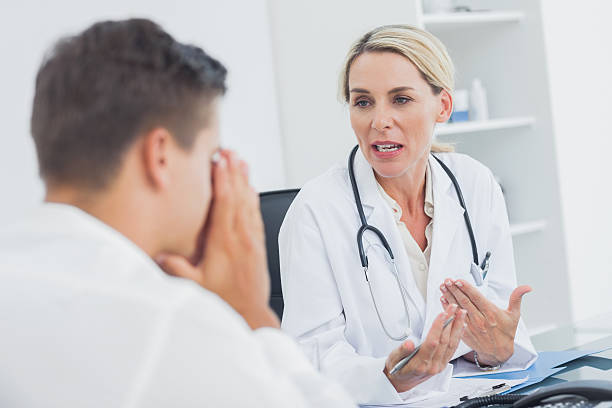 istock Doctor having a discussion with he worried patient 459208755