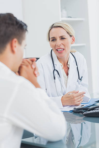 istock Doctor discussing with a worried patient 459208763