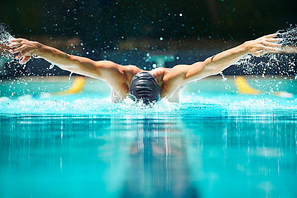 perfetto nuoto a farfalla. - resistenza concetto foto e immagini stock