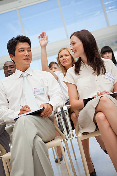 istock Man and woman look at one another in work 459216407