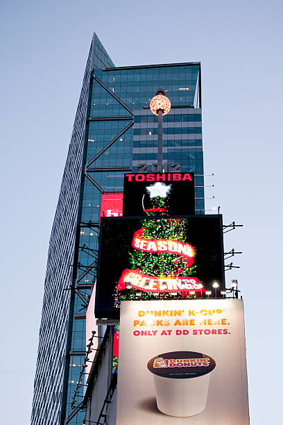 Times Square Ball in New York City New York, New York, USA - December 28, 2011: The Times Square Ball is lit up on top of the One Times Square building in Times Square. The ball drops to the bottom of the pole each year on New Year\'s Eve at midnight. times square new years eve stock pictures, royalty-free photos & images