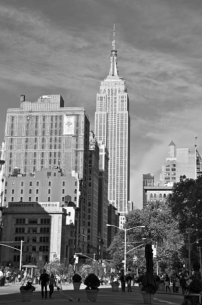 New York City, USA - October 16, 2011: A cityscape scene on Manhattan with the Empire State Building towering over lower 5th Avenue as seen from 22nd Street and Broadway.