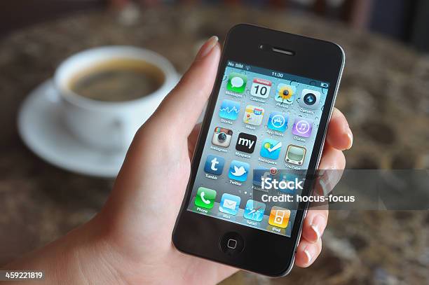 Using Iphone In A Coffee Shop Stock Photo - Download Image Now - LinkedIn, Google - Brand-name, People