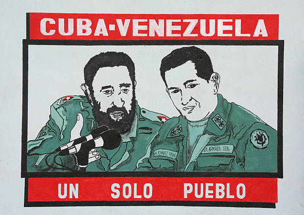 Rafael Freyre, Cuba-March 03, 2010\n\nPoster in a small Cuban village in Holguín Province of Cuba showing Castro in army fatiques brandishing a rifle with  revolutionary text written in Spanish. ... touching the soul of a village... Rebels with a cause - social workers