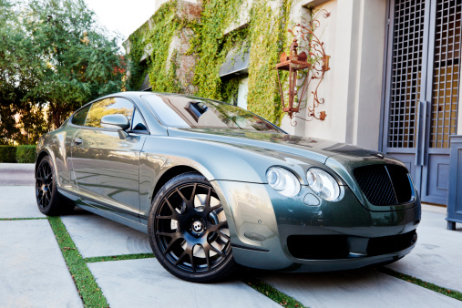 Scottsdale, Arizona, United States - December 29, 2011: A photo of a silver Bentley Continental coupe. Bentley is a luxury car company owned by Volkswagen that is based out of Chesire, England.