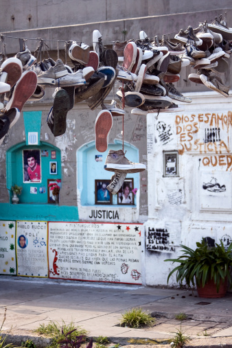 Buenos Aires, Argentina - February 26, 2011: Popular shrine erected in honor of the 194 young people died in the fire at the disco CromaAAn, the December 30, 2004. Hanging sneakers symbolize each of the victims.