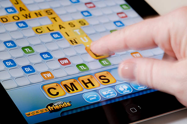 Playing Words with Friends on an iPad Horizontal stock photo