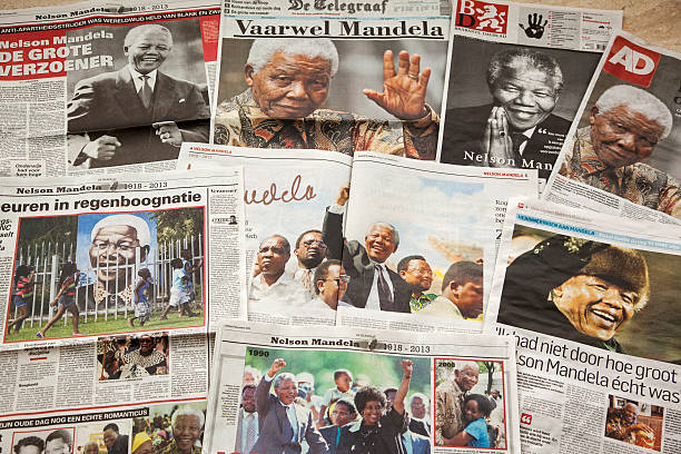 Nelson Mandela # 1 XXXL Amsterdam, the Netherlands - December 6, 2013: A number of Dutch newspapers with the news about the death of Nelson Mandela. South Africa's first black president and anti-apartheid icon Nelson Mandela has died at the age of 95 on Thursday at the age of 95. Mandela was in prison at Robben Island for nearly three decades for his fight against white minority rule. In 1993, Mandela was awarded the Nobel Peace Prize, an honor he shared with F.W. de Klerk, the white Afrikaner leader. Earlier this year, Mandela spent nearly three months in hospital with a recurring lung infection. apartheid stock pictures, royalty-free photos & images