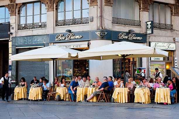 Water jets produce spray to cool off the restaurant area on a Milano street in Summer