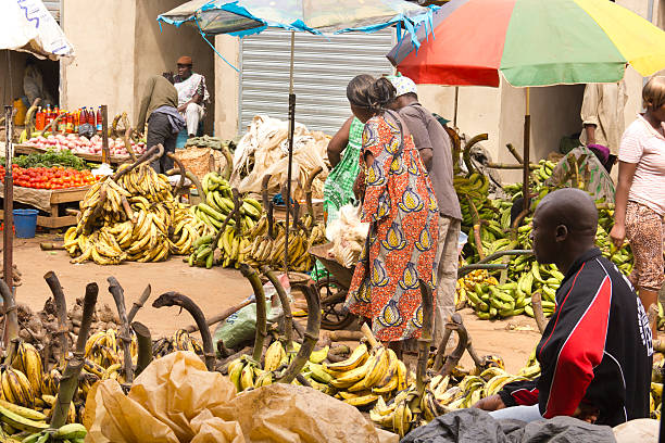 Yaounde Market day Yaounde, Cameroon - March 08, 2011: People on a crowded market on the street. There are a lot of bananas on this side of the market. yaounde photos stock pictures, royalty-free photos & images