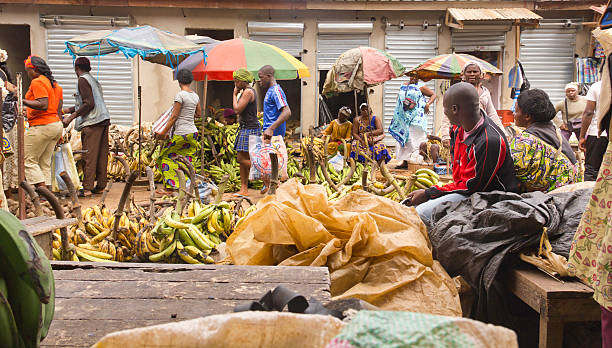 Yaounde Market day Yaounde, Cameroon - March 08, 2011: People on a crowded market on the street. There are a lot of bananas on this side of the market. yaounde photos stock pictures, royalty-free photos & images