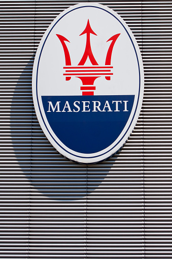 Modena, Italy - May 28, 2011: The oval shaped logo with trident, symbol of Maserati, the italian luxury car manufacturer.