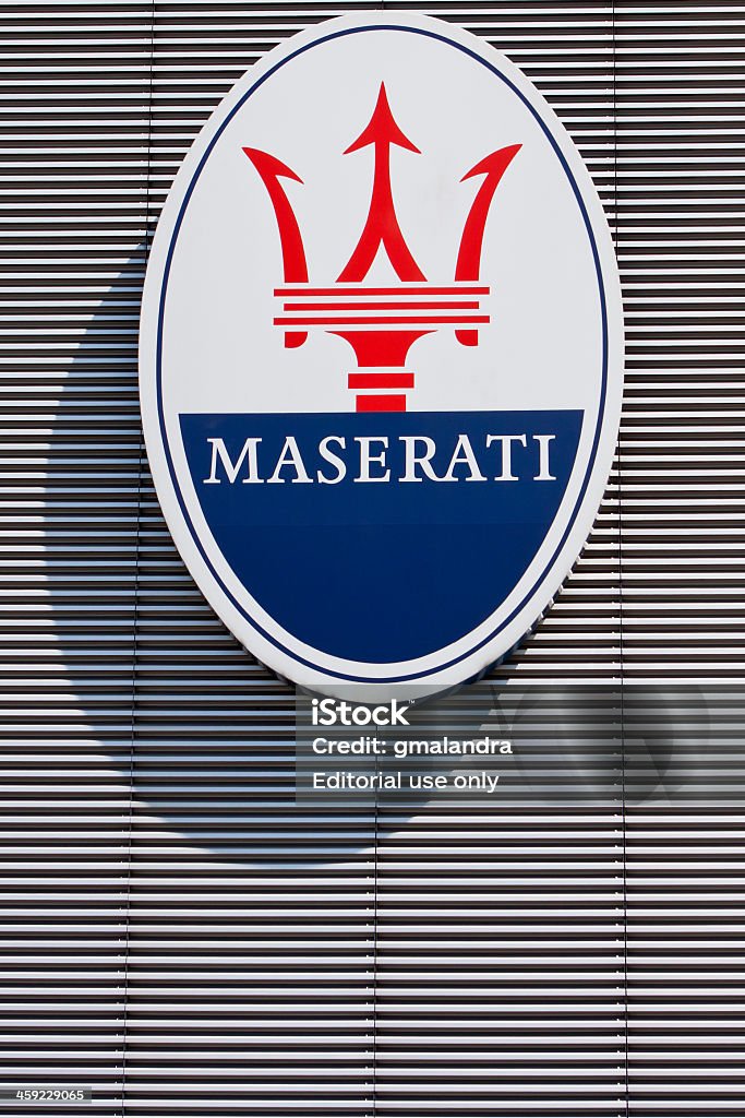 Maserati logo Modena, Italy - May 28, 2011: The oval shaped logo with trident, symbol of Maserati, the italian luxury car manufacturer. Maserati Stock Photo